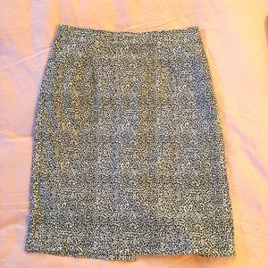 Pencil skirt. Black & white animal print. Form-fitting. Stretchy. 30 inch waist.